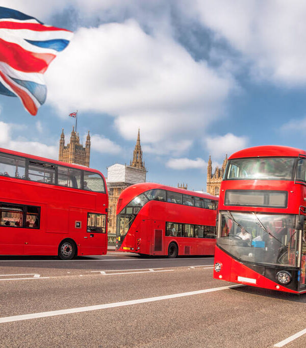 Big Ben with red buses in London, England, UK